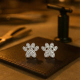 Heart-shaped earrings with a cat paw design and white zirconia
